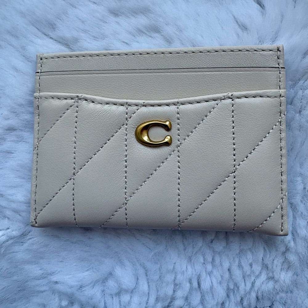Essential card case, new but has a tiny scab in the back